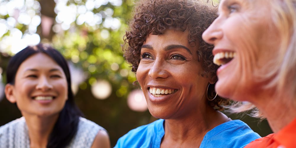 Woman with improved bladder control smiles after finding a urogynecologist near her