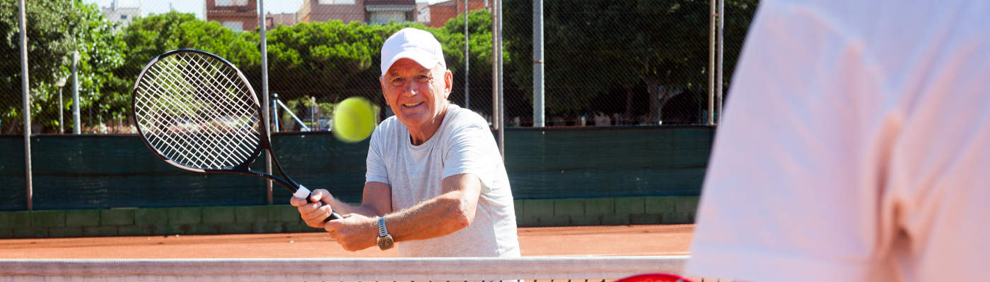 Man plays tennis after total joint replacement surgery.